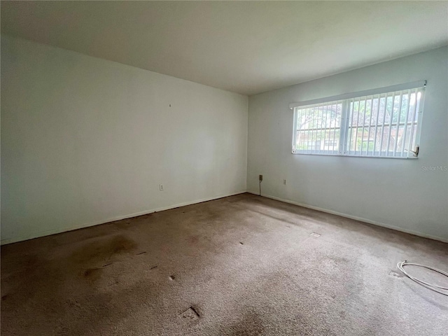 1510 Mission Hills Blvd Unit 19-F, Clearwater, FL 33759 - spare room with carpet and baseboards