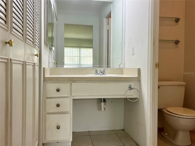 1510 Mission Hills Blvd Unit 19-F, Clearwater, FL 33759 - bathroom with tile patterned flooring, toilet, and vanity