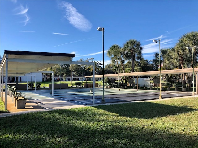 1510 Mission Hills Blvd Unit 19-F, Clearwater, FL 33759 - view of property's community with a lawn and shuffleboard