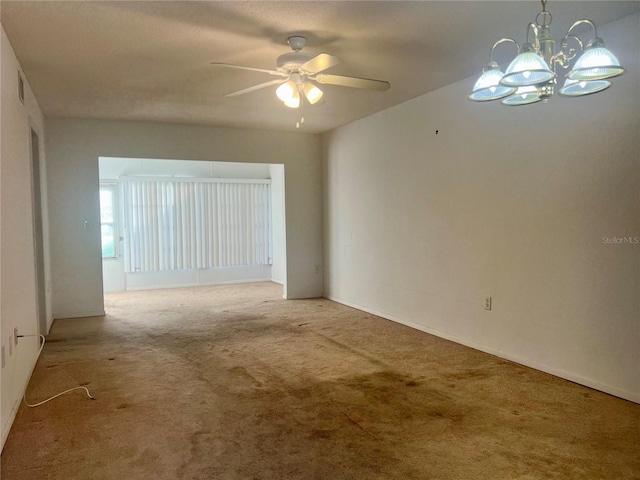 1510 Mission Hills Blvd Unit 19-F, Clearwater, FL 33759 - empty room with carpet flooring, a ceiling fan, a chandelier, and baseboards