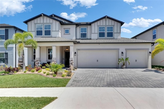 5026 Bromeliad Ave, Wimauma, FL 33598 - view of front of property with decorative driveway, stucco siding, and roof with shingles