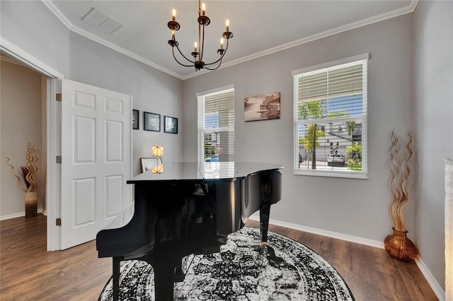 5026 Bromeliad Ave, Wimauma, FL 33598 - living area featuring a chandelier, plenty of natural light, wood finished floors, crown molding, and baseboards