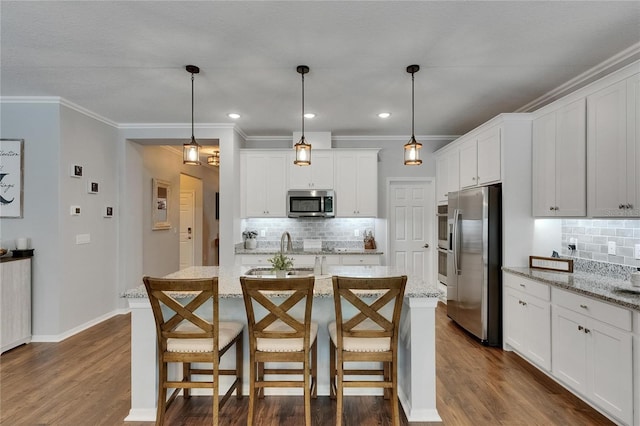 5026 Bromeliad Ave, Wimauma, FL 33598 - kitchen with appliances with stainless steel finishes, tasteful backsplash, dark wood-style flooring, white cabinetry, and crown molding