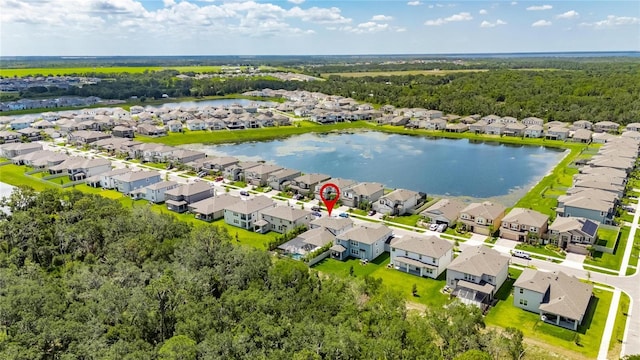 5026 Bromeliad Ave, Wimauma, FL 33598 - aerial view of residential area with a nearby body of water and a forest