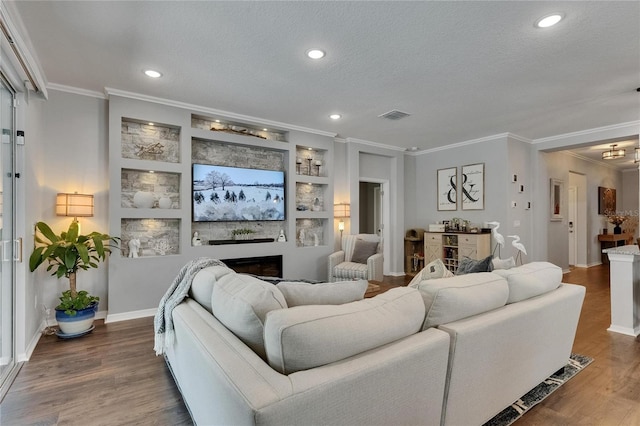5026 Bromeliad Ave, Wimauma, FL 33598 - living area with ornamental molding, a textured ceiling, wood finished floors, recessed lighting, and baseboards