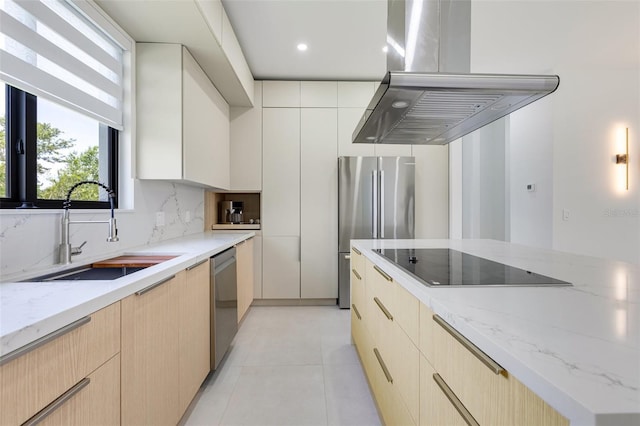 3578 NE 9th Pl, Cape Coral, FL 33909 - kitchen with island exhaust hood, appliances with stainless steel finishes, a sink, modern cabinets, and backsplash