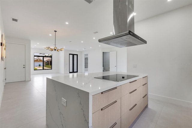 3578 NE 9th Pl, Cape Coral, FL 33909 - kitchen with black electric stovetop, island range hood, modern cabinets, recessed lighting, and open floor plan