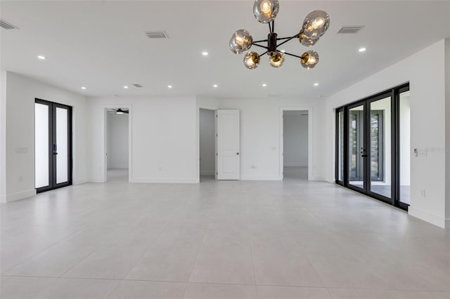 3578 NE 9th Pl, Cape Coral, FL 33909 - spare room featuring french doors, a chandelier, recessed lighting, light tile patterned floors, and baseboards