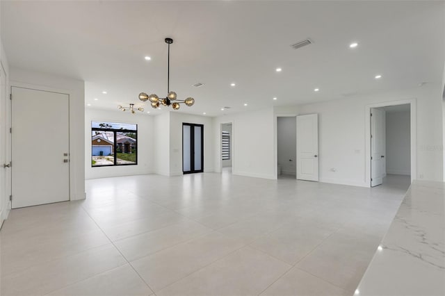 3578 NE 9th Pl, Cape Coral, FL 33909 - spare room featuring recessed lighting, a chandelier, baseboards, and light tile patterned flooring