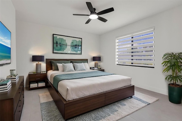3578 NE 9th Pl, Cape Coral, FL 33909 - bedroom with light tile patterned floors, ceiling fan, and baseboards