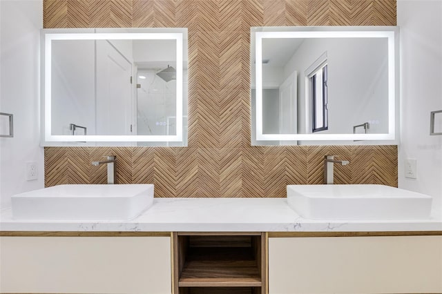 3578 NE 9th Pl, Cape Coral, FL 33909 - bathroom with double vanity, walk in shower, and decorative backsplash