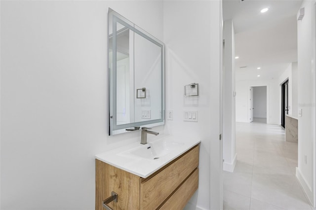 3578 NE 9th Pl, Cape Coral, FL 33909 - bathroom with vanity, tile patterned floors, baseboards, and recessed lighting