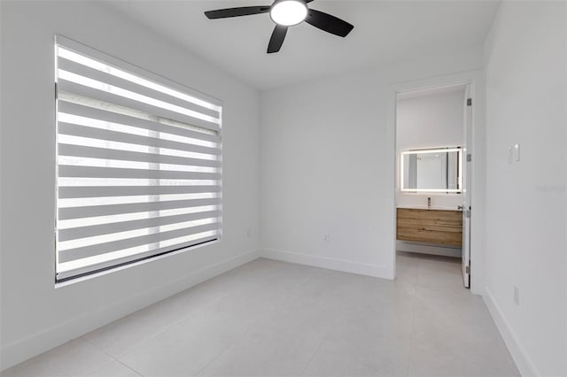 3578 NE 9th Pl, Cape Coral, FL 33909 - unfurnished room with ceiling fan, light tile patterned floors, and baseboards