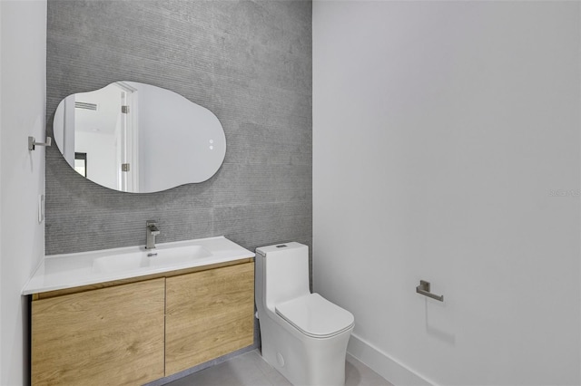 3578 NE 9th Pl, Cape Coral, FL 33909 - bathroom with toilet, vanity, and tile patterned flooring