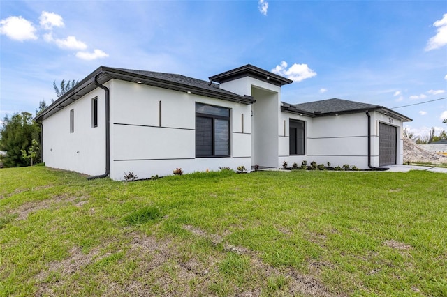 3578 NE 9th Pl, Cape Coral, FL 33909 - view of front of home with a garage, a front yard, stucco siding, and driveway