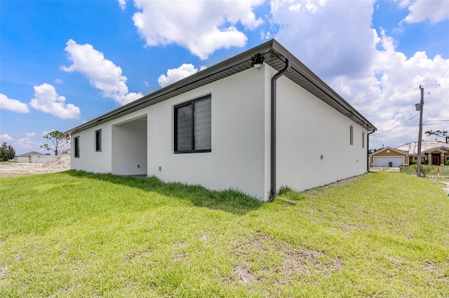 3578 NE 9th Pl, Cape Coral, FL 33909 - view of property exterior featuring stucco siding and a yard