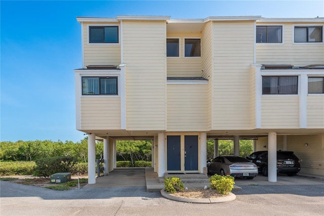 1500 Sunset Rd Unit C10, Tarpon Springs, FL 34689 - view of building exterior featuring a carport