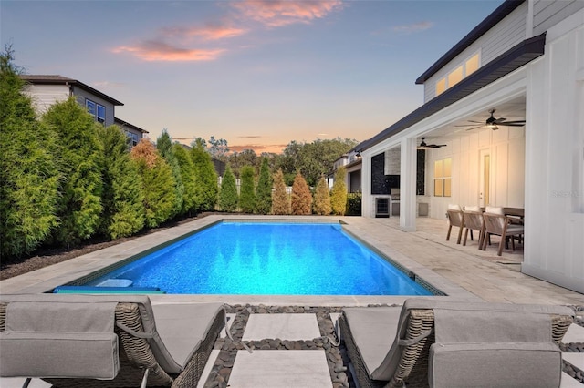 13859 Sharp Hawk Dr, Riverview, FL 33569 - pool at dusk with a patio area, a ceiling fan, and an outdoor pool