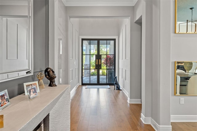 13859 Sharp Hawk Dr, Riverview, FL 33569 - foyer with wood finished floors, french doors, crown molding, and baseboards