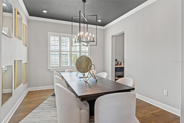 13859 Sharp Hawk Dr, Riverview, FL 33569 - dining area featuring a chandelier, dark wood-style flooring, ornamental molding, baseboards, and a textured ceiling