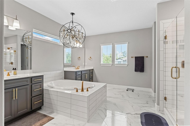 13859 Sharp Hawk Dr, Riverview, FL 33569 - bathroom featuring marble finish floors, a shower stall, a bath, two vanities, and a chandelier