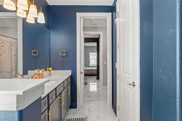 13859 Sharp Hawk Dr, Riverview, FL 33569 - full bathroom with marble finish floors, vanity, a chandelier, and baseboards
