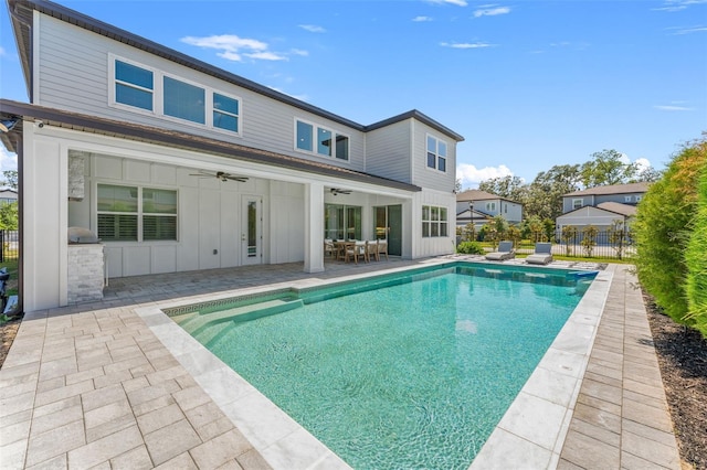 13859 Sharp Hawk Dr, Riverview, FL 33569 - back of property featuring ceiling fan, board and batten siding, a patio area, area for grilling, and outdoor dining space