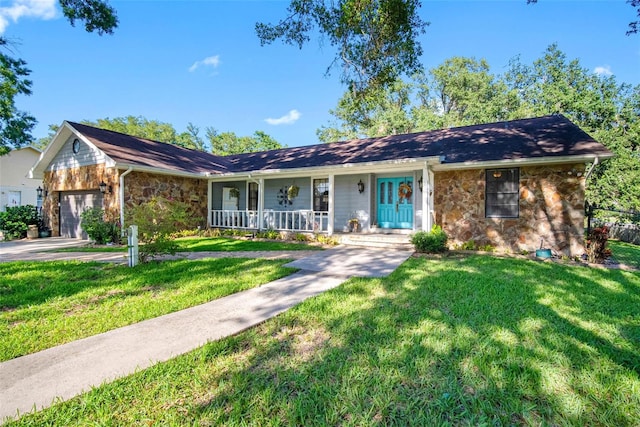 11109 Winn Rd, Riverview, FL 33569 - single story home with stone siding, a porch, a garage, and a front yard