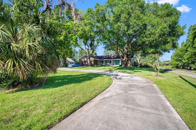 11109 Winn Rd, Riverview, FL 33569 - view of front of house featuring a front yard and concrete driveway