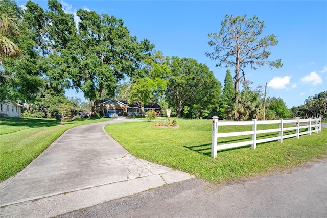 11109 Winn Rd, Riverview, FL 33569 - view of front of property featuring concrete driveway and view of wooded area