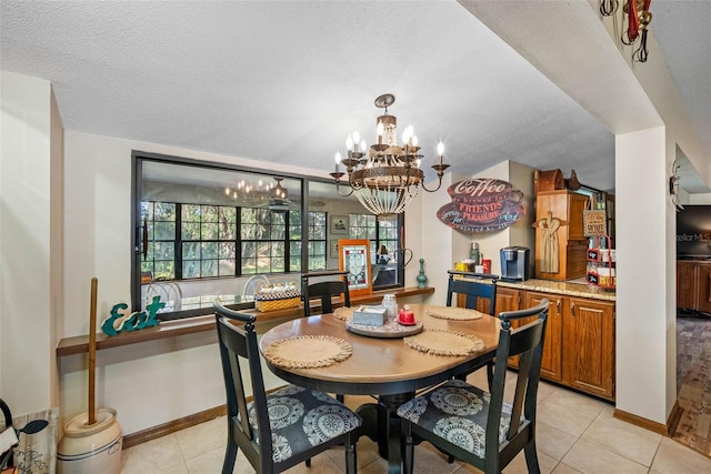 11109 Winn Rd, Riverview, FL 33569 - dining area with a chandelier, light tile patterned flooring, baseboards, and a textured ceiling