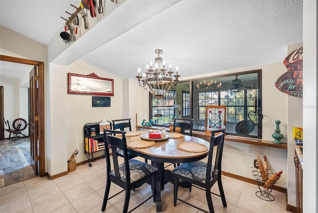 11109 Winn Rd, Riverview, FL 33569 - dining space featuring baseboards, a chandelier, light tile patterned floors, and vaulted ceiling