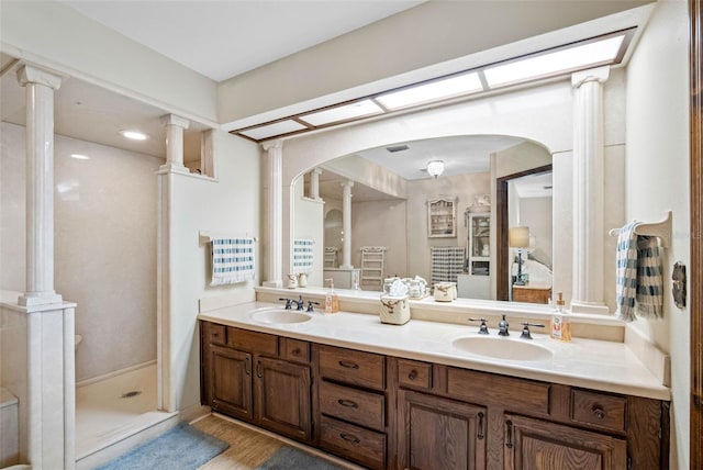 11109 Winn Rd, Riverview, FL 33569 - full bath with double vanity, wood finished floors, and a stall shower