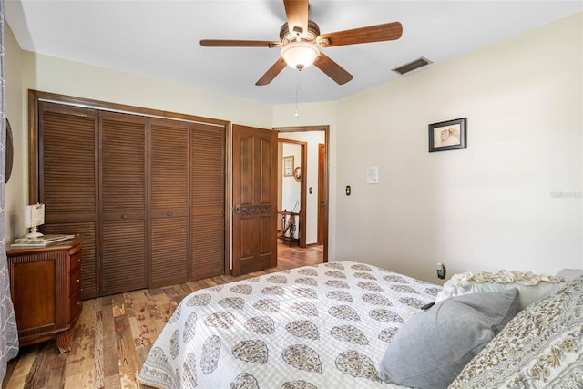 11109 Winn Rd, Riverview, FL 33569 - bedroom with a closet, wood finished floors, and ceiling fan