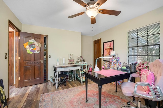 11109 Winn Rd, Riverview, FL 33569 - home office with wood finished floors and a ceiling fan