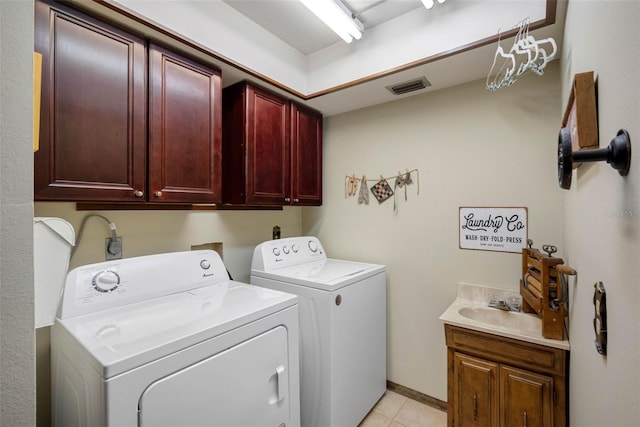 11109 Winn Rd, Riverview, FL 33569 - washroom with cabinet space, washing machine and dryer, and light tile patterned floors