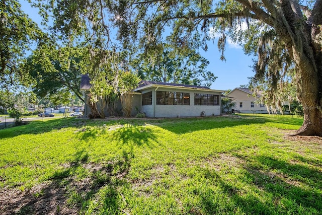 11109 Winn Rd, Riverview, FL 33569 - back of house featuring a yard