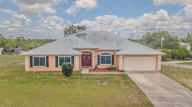 5432 Queen Ave, Spring Hill, FL 34609 - view of front of home featuring a garage, stucco siding, concrete driveway, and metal roof
