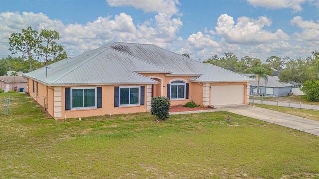 5432 Queen Ave, Spring Hill, FL 34609 - ranch-style home with a garage, driveway, metal roof, and stucco siding