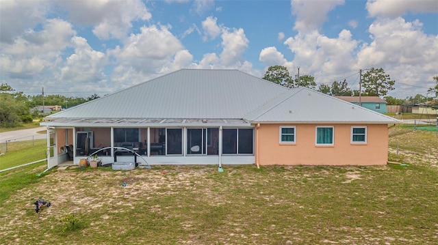 5432 Queen Ave, Spring Hill, FL 34609 - back of property with a sunroom and stucco siding