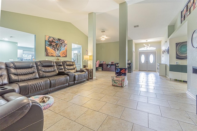 5432 Queen Ave, Spring Hill, FL 34609 - living area featuring light tile patterned floors, vaulted ceiling, and ceiling fan