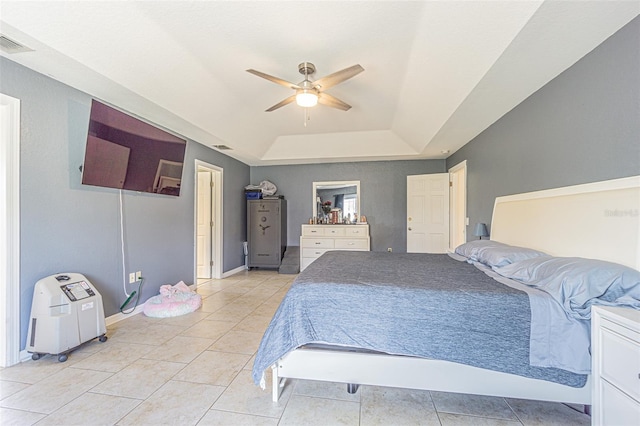 5432 Queen Ave, Spring Hill, FL 34609 - bedroom with a raised ceiling, light tile patterned floors, and a ceiling fan