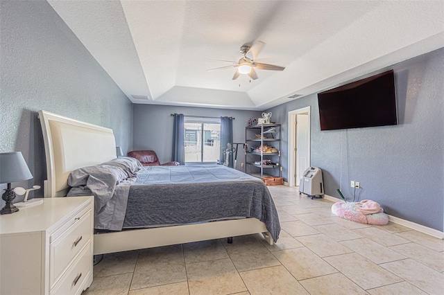 5432 Queen Ave, Spring Hill, FL 34609 - bedroom featuring a tray ceiling, a textured wall, a ceiling fan, and baseboards