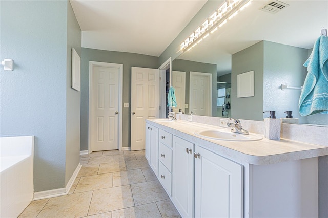 5432 Queen Ave, Spring Hill, FL 34609 - bathroom with double vanity, a bath, a shower with shower door, baseboards, and tile patterned flooring