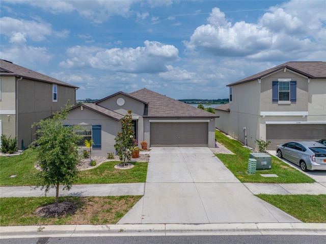 31775 Sun Kettle Loop, Wesley Chapel, FL 33545 - traditional-style home featuring stucco siding, concrete driveway, an attached garage, and a front yard