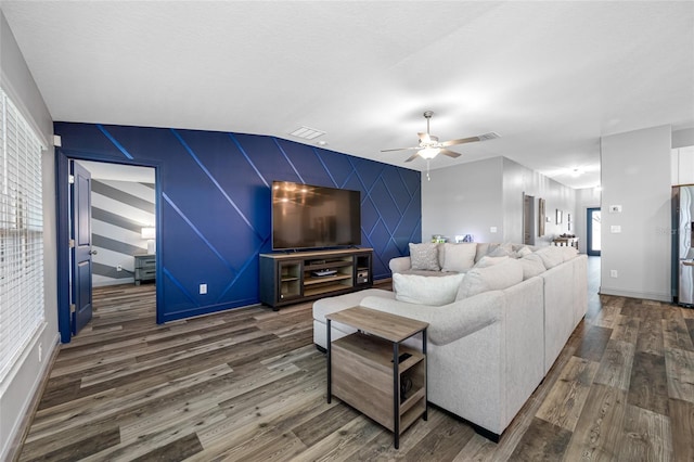 31775 Sun Kettle Loop, Wesley Chapel, FL 33545 - living room featuring wood finished floors, ceiling fan, an accent wall, and baseboards