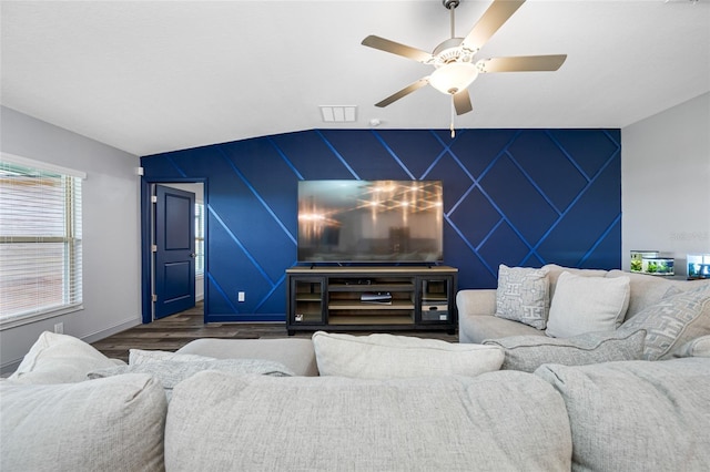 31775 Sun Kettle Loop, Wesley Chapel, FL 33545 - living area featuring an accent wall, wood finished floors, a ceiling fan, and baseboards