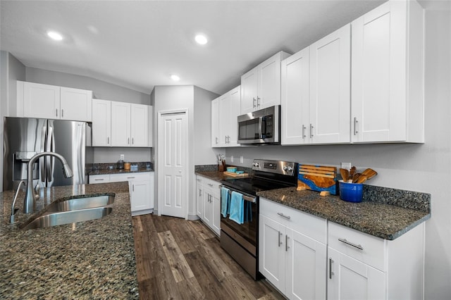31775 Sun Kettle Loop, Wesley Chapel, FL 33545 - kitchen featuring stainless steel appliances, a sink, dark wood-style floors, recessed lighting, and white cabinetry