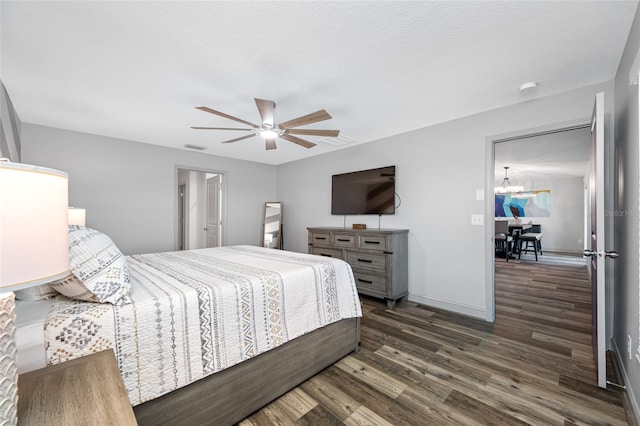31775 Sun Kettle Loop, Wesley Chapel, FL 33545 - bedroom featuring dark wood finished floors, a ceiling fan, and baseboards