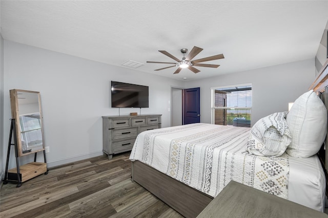 31775 Sun Kettle Loop, Wesley Chapel, FL 33545 - bedroom with wood finished floors, baseboards, and ceiling fan